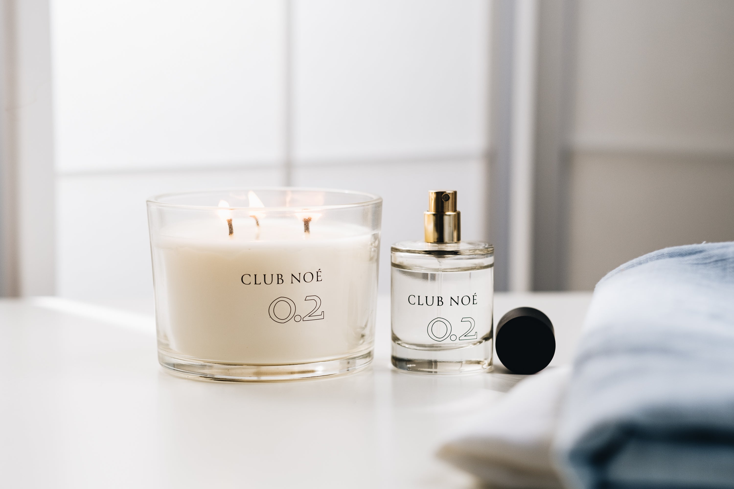 0.2 Soul Set bestehend aus 0.2 Eau de Parfum und 0.2 Duftkerze in durchsichtigem Glas, von Club Noe
